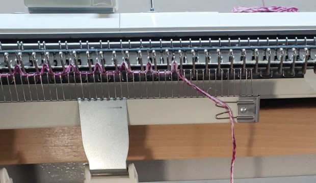 The manual suggests securing the tail to the cast on comb Some cast on combs don't have clips and this can be fiddly.